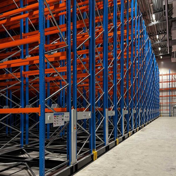 Mobile racking system creating high-density pallet storage inside a freezer warehouse environment